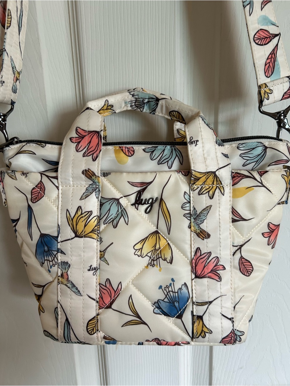 Lug Dori Mini crossbody. Off white with hummingbirds and flowers